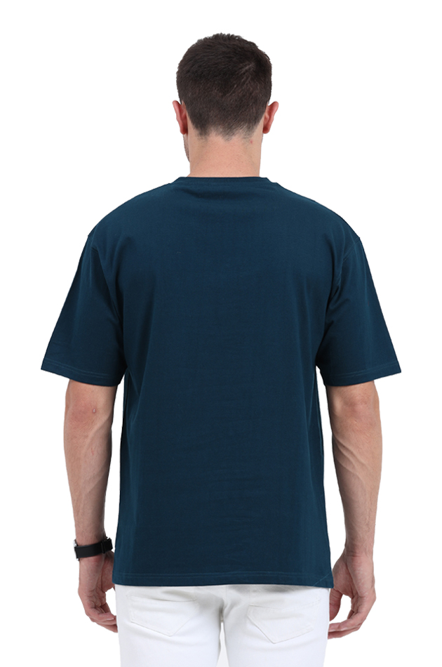 Back view of a man wearing a comfy oversized unisex T-shirt in dark blue, perfect for summer essentials and cool swag.