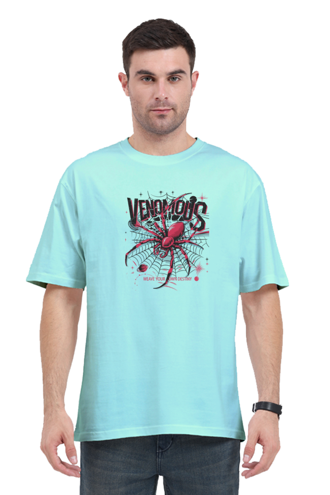 Model wearing a cool oversized Venomous t-shirt for summer, showcasing spider graphic on soft teal fabric.