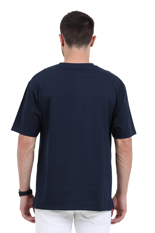 Back view of a man wearing a comfy unisex oversized t-shirt, perfect for summer essentials and cool swag.
